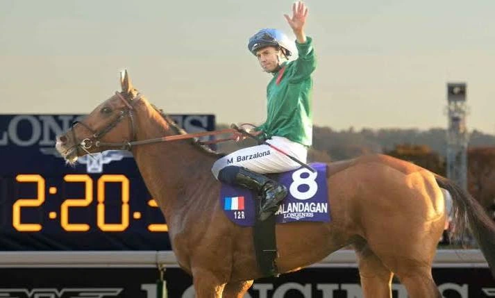 Mickaël Barzalona waves from Alandagan after completing a race in 2:20.